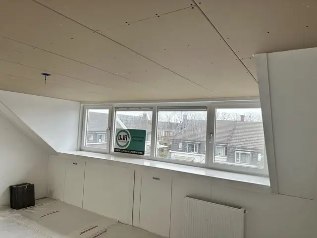 Zolder geïsoleerd en ingedeeld, foto 1 van 17